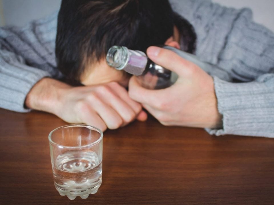 man drinking alcohol