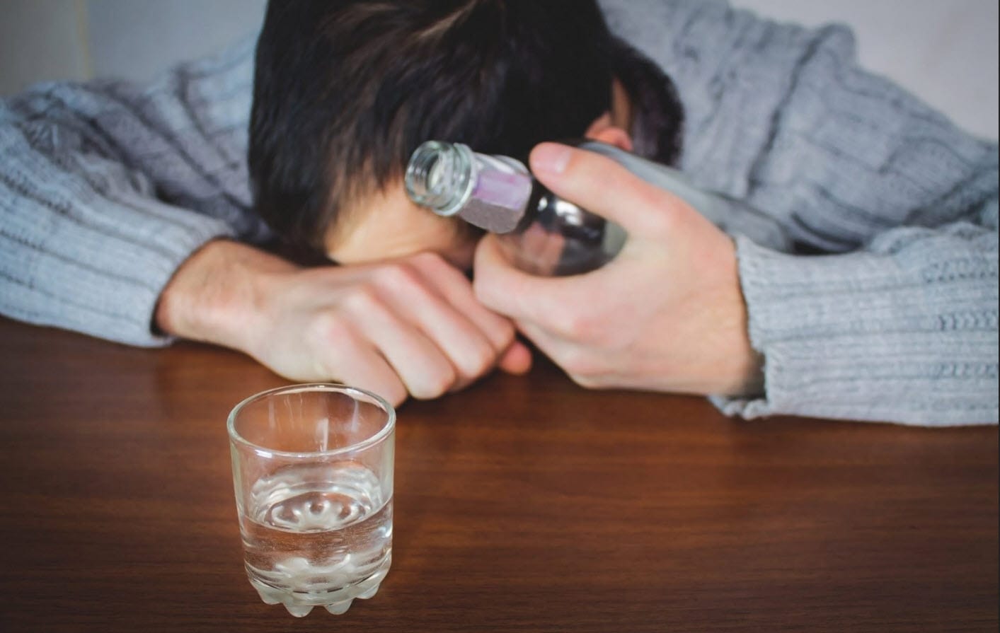 man drinking alcohol