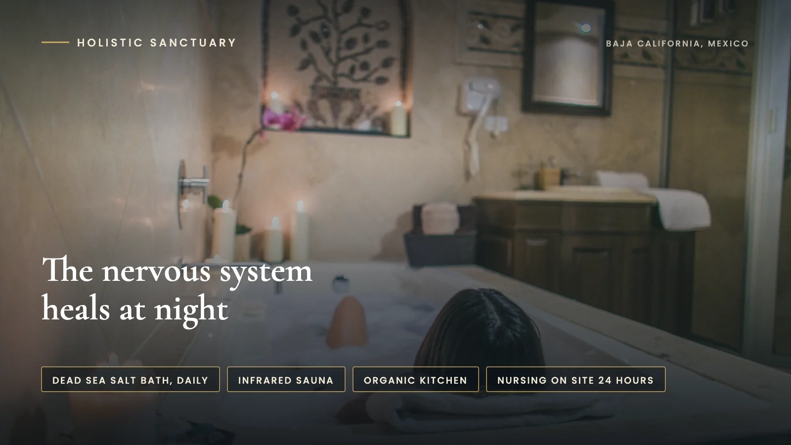 Infographic over a candlelit bath at Holistic Sanctuary in Baja California, Mexico, stating that the nervous system heals at night, with labels for a daily Dead Sea salt bath, infrared sauna, organic kitchen, and nursing on site 24 hours.